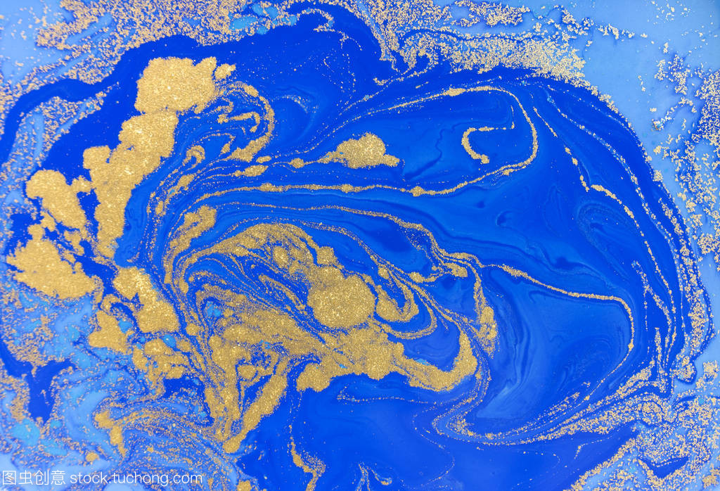 蓝色和金色的液体纹理。水彩手绘大理石纹图。油墨大理石背景